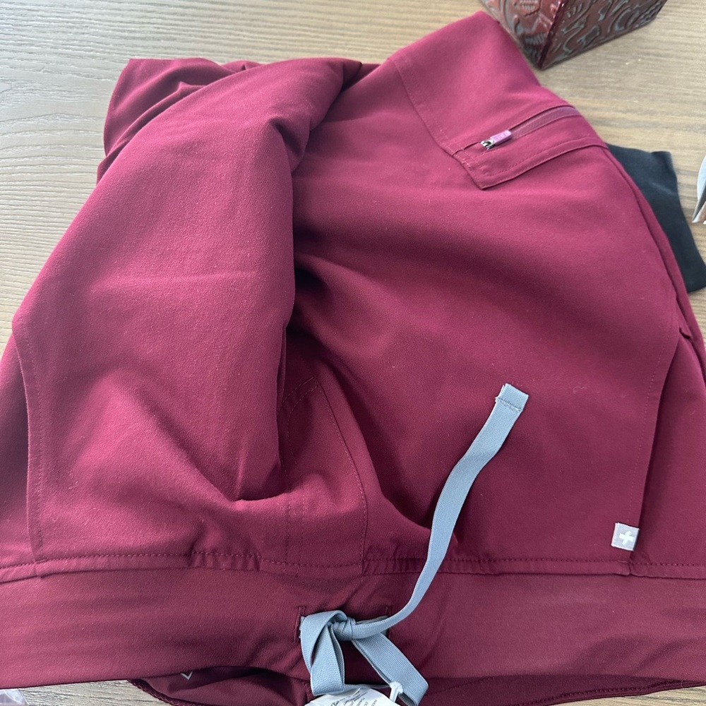 A brand NWT SCRUB ZAMORA JOGGERS- black m and burgundy l